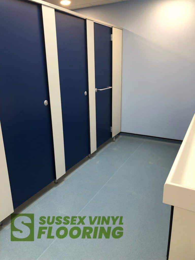 Flooring fitted before cubicles installed.